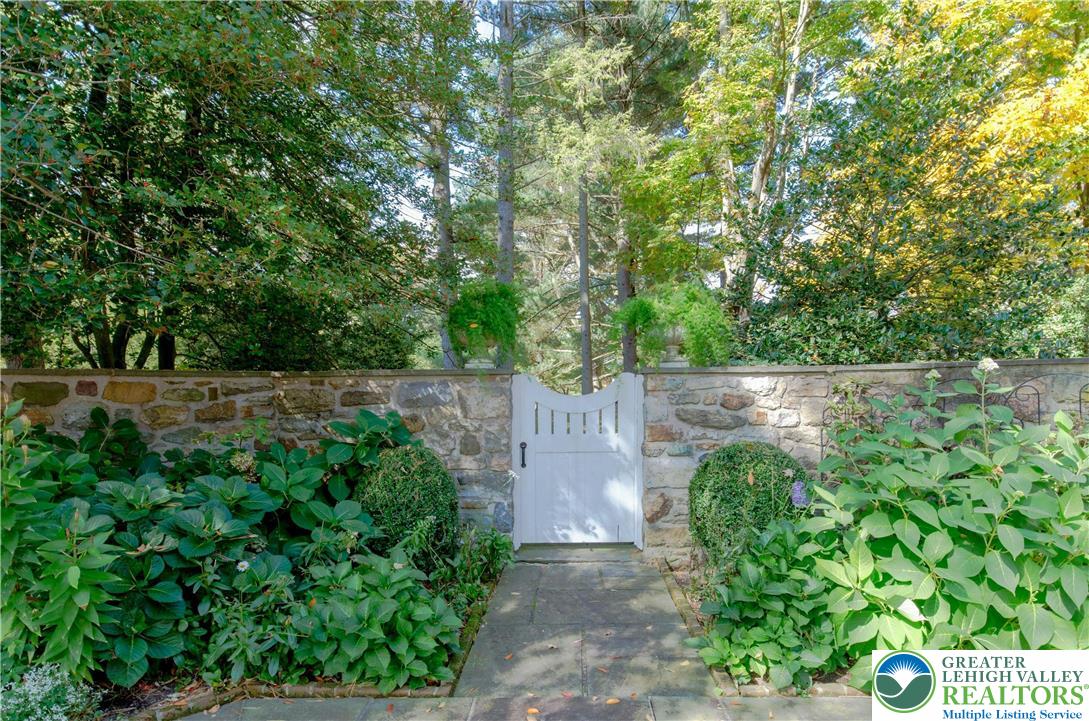 1803 Apple Tree Lane Bethlehem, PA 18015 - Photo 32 of 47 a backyard of a house with lots of green space and plants