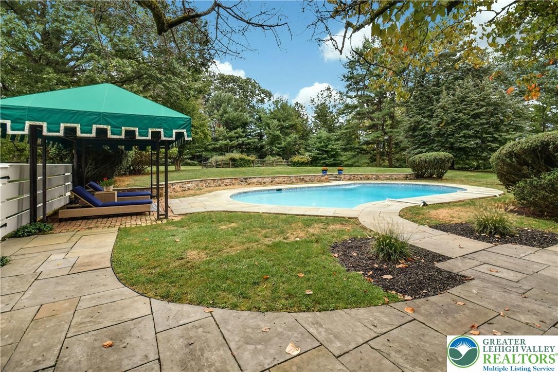 1803 Apple Tree Lane Bethlehem, PA 18015 - Photo 38 of 47 a view of a swimming pool with lounge chair
