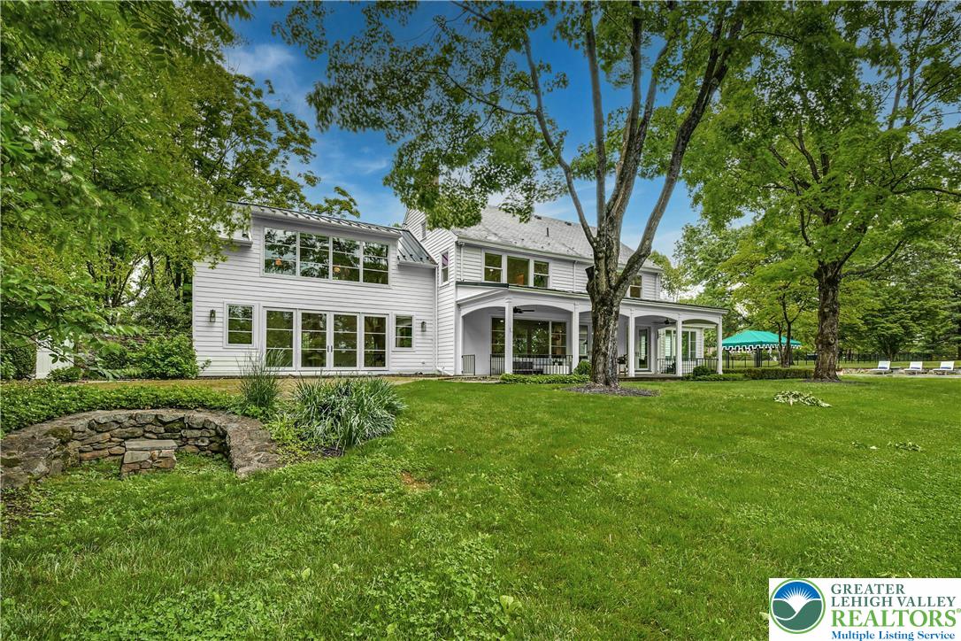 1803 Apple Tree Lane Bethlehem, PA 18015 - Photo 40 of 47 a view of a big yard with a house and garden