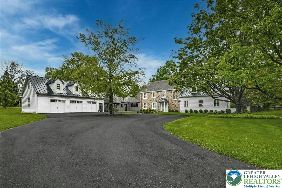1803 Apple Tree Lane Bethlehem, PA 18015 - Photo 47 of 47 a front view of a house with a yard and garage
