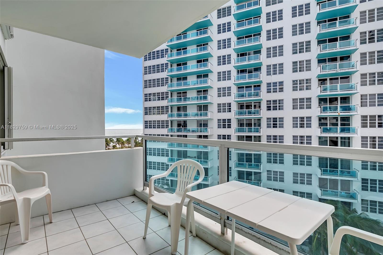 5151 Collins Avenue, Unit 729 Miami Beach, FL 33140 - Photo 14 of 35 a workspace with a table and chair