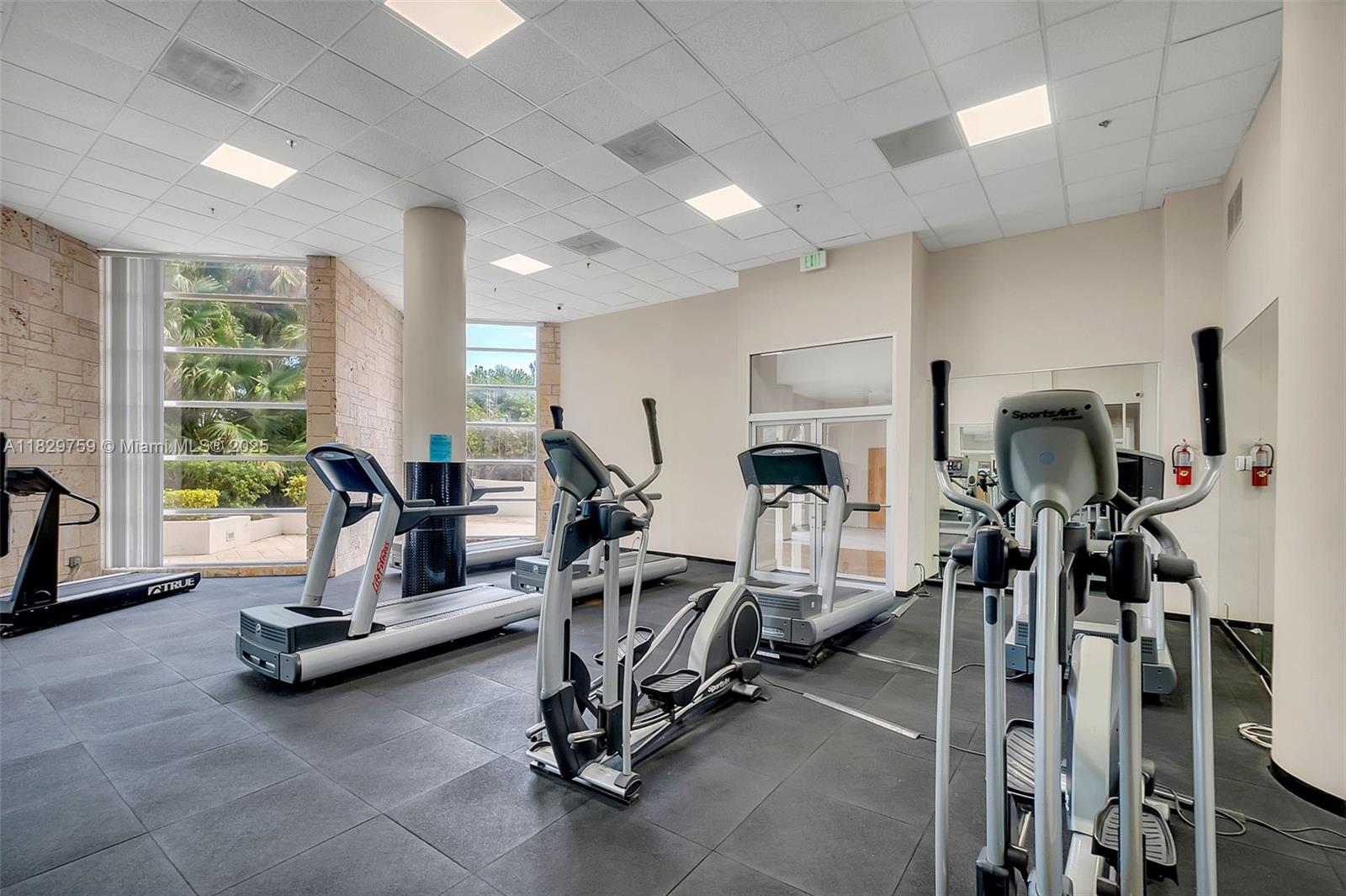 5151 Collins Avenue, Unit 729 Miami Beach, FL 33140 - Photo 21 of 35 a view of a room with gym equipment