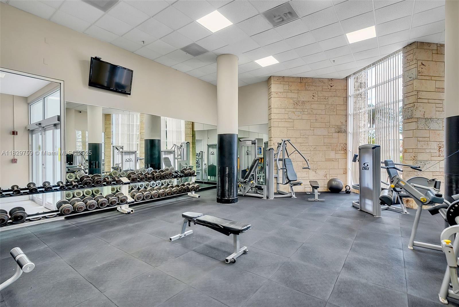 5151 Collins Avenue, Unit 729 Miami Beach, FL 33140 - Photo 22 of 35 a view of a room with gym equipment