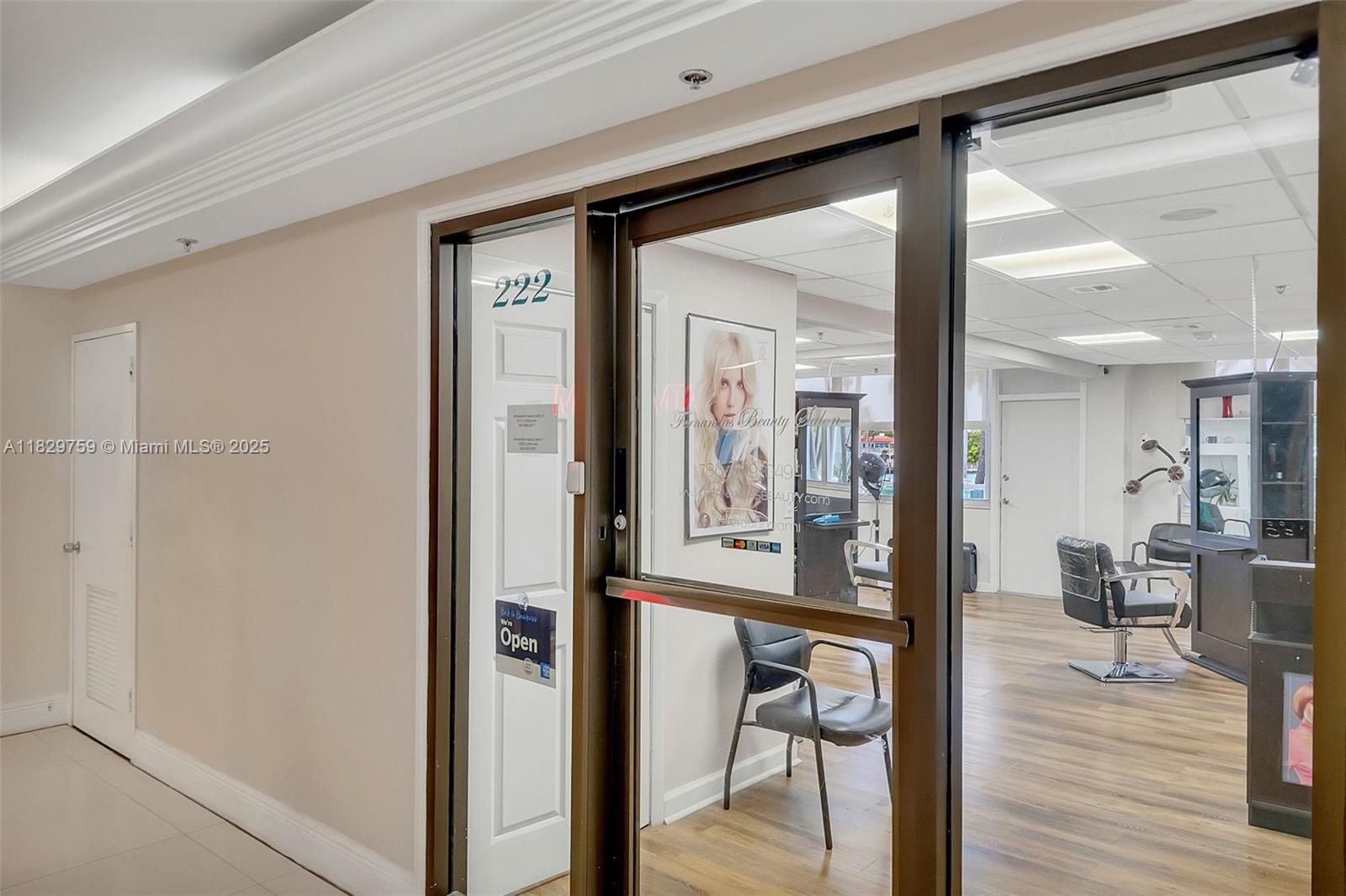 5151 Collins Avenue, Unit 729 Miami Beach, FL 33140 - Photo 28 of 35 a view of a hallway with wooden floor windows and a livingroom