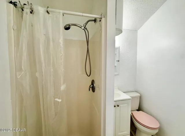 a bathroom with a shower curtain