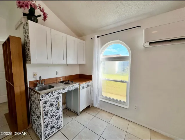 a kitchen with stainless steel appliances granite countertop a stove a refrigerator and a microwave