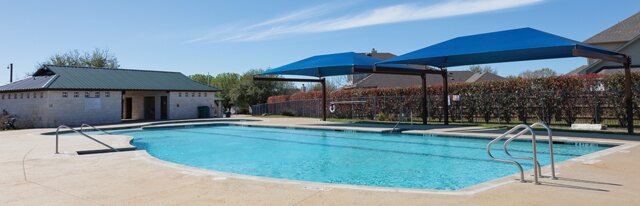 20724 Kearney Hill Road Pflugerville, TX 78660 - Photo 36 of 40 Swimming pool with concrete decking and metal handrails