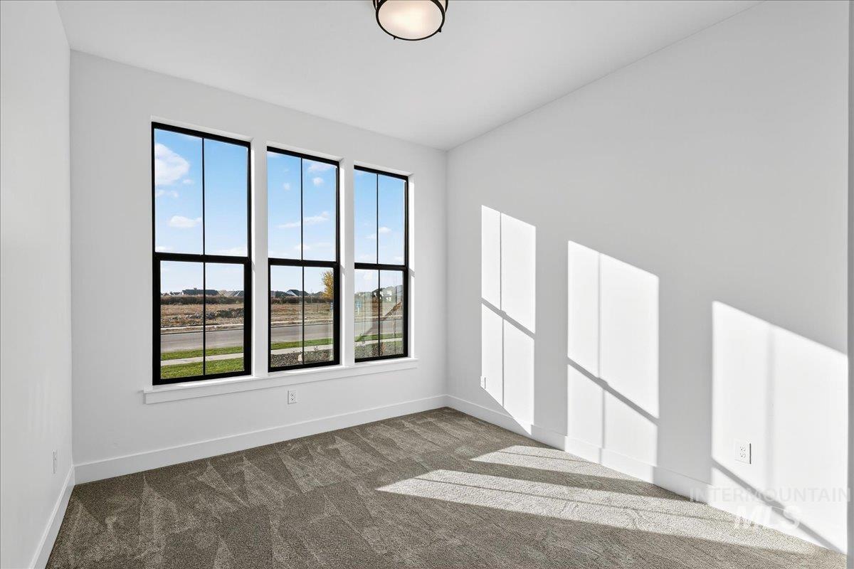 7714 West Flathead Lake Street, Unit ASPEN Eagle, ID 83616 - Photo 20 of 30 Unfurnished room with carpet floors and baseboards