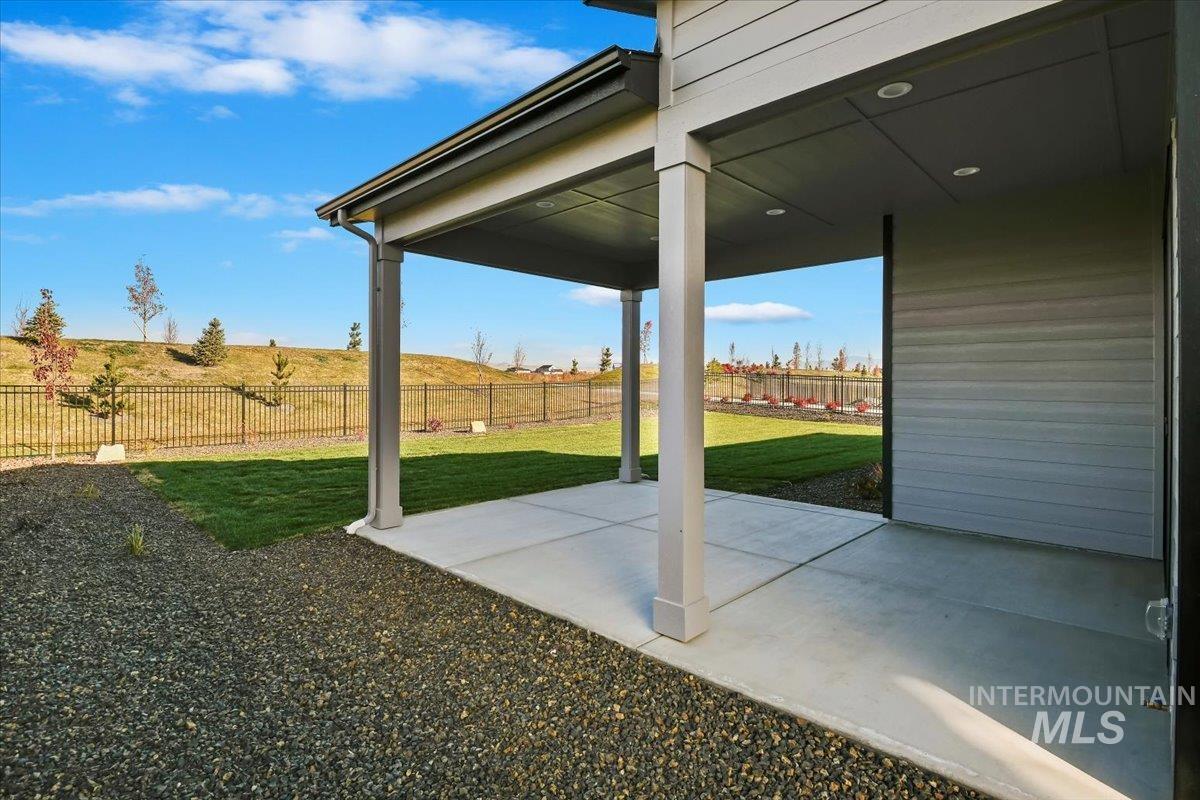 7714 West Flathead Lake Street, Unit ASPEN Eagle, ID 83616 - Photo 29 of 30 Fenced backyard featuring a patio