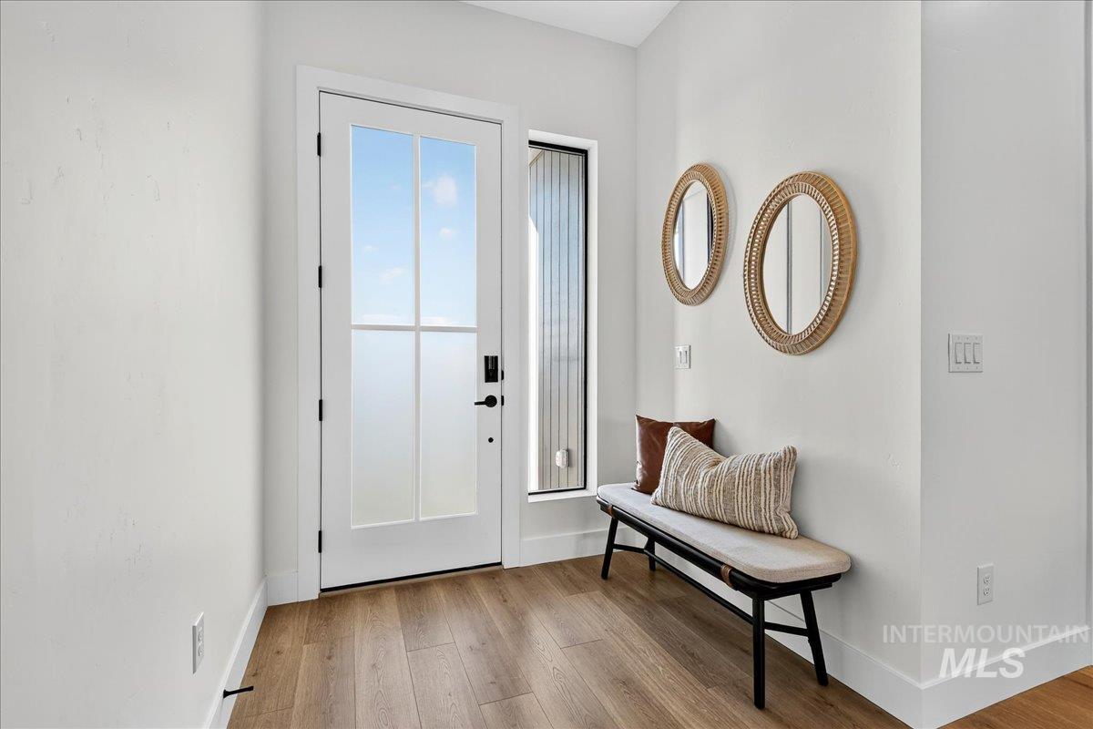 7714 West Flathead Lake Street, Unit ASPEN Eagle, ID 83616 - Photo 3 of 30 Entrance foyer with wood finished floors and baseboards
