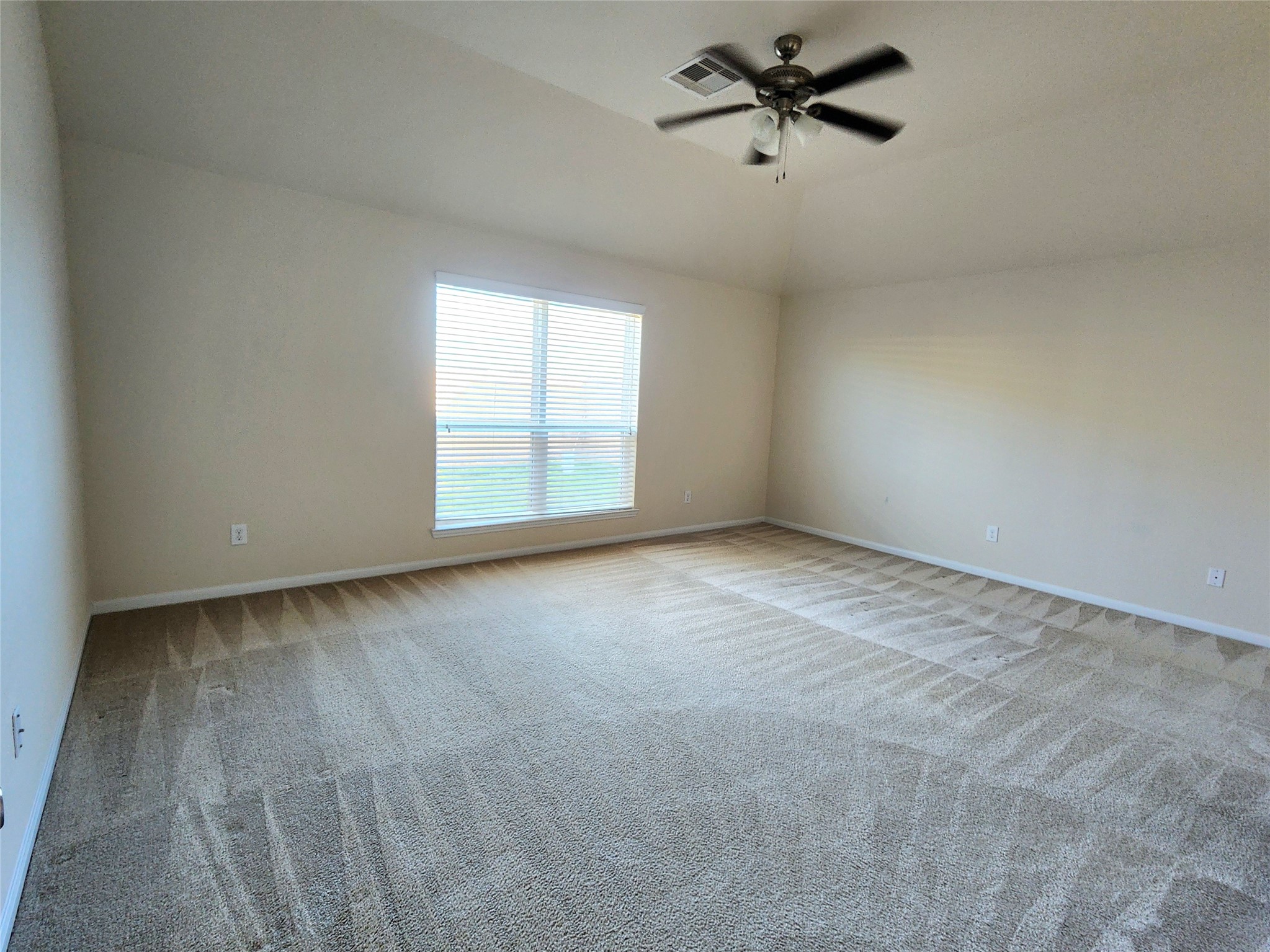 5427 Seabird Street Baytown, TX 77521 - Photo 12 of 34 19'x15' primary bedroom faces backyard for privacy and provides a ceiling fan for comfort.