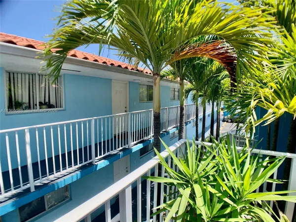 a view of a house with a flower garden