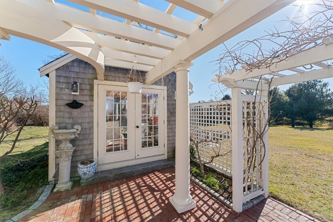 24 Little Harbor Road Tiverton, RI 02878 - Photo 43 of 46 Pergola and patio. Included is a cover for the pergola.