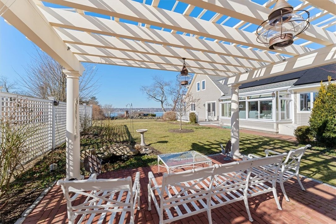 24 Little Harbor Road Tiverton, RI 02878 - Photo 45 of 46 Pergola and patio with water views.