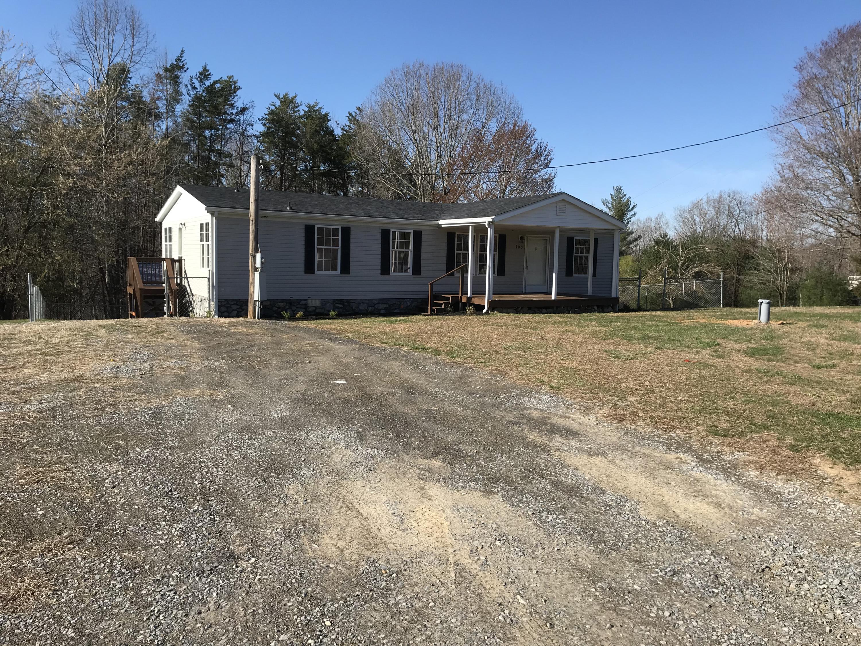 100 Deerhill Road Goodview, VA 24095 - Photo 1 of 7 a front view of a house with a yard and garage