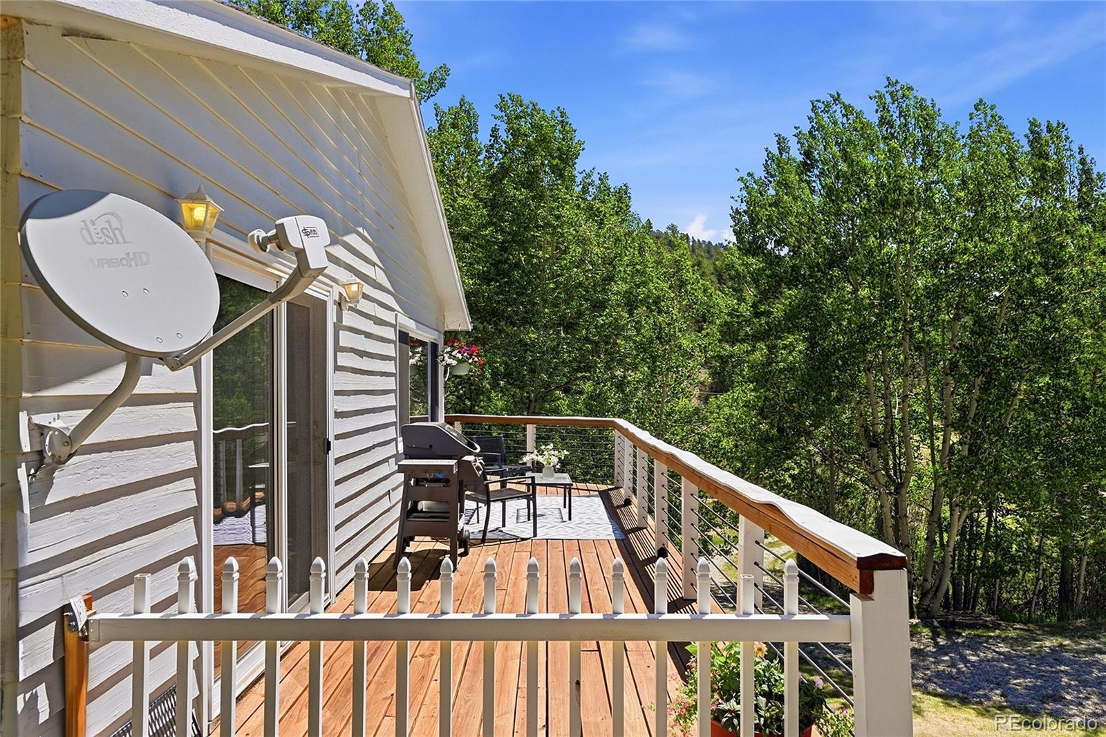 427 Brookside Drive Bailey, CO 80421 - Photo 20 of 37 a view of balcony with wooden floor and seating space