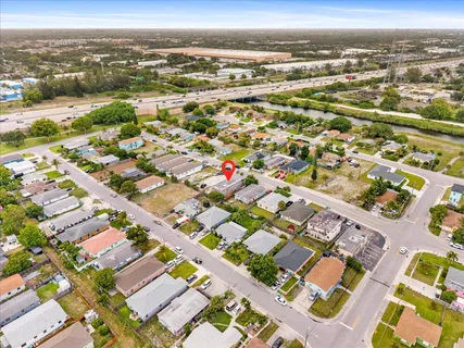 an aerial view of residential houses with outdoor space