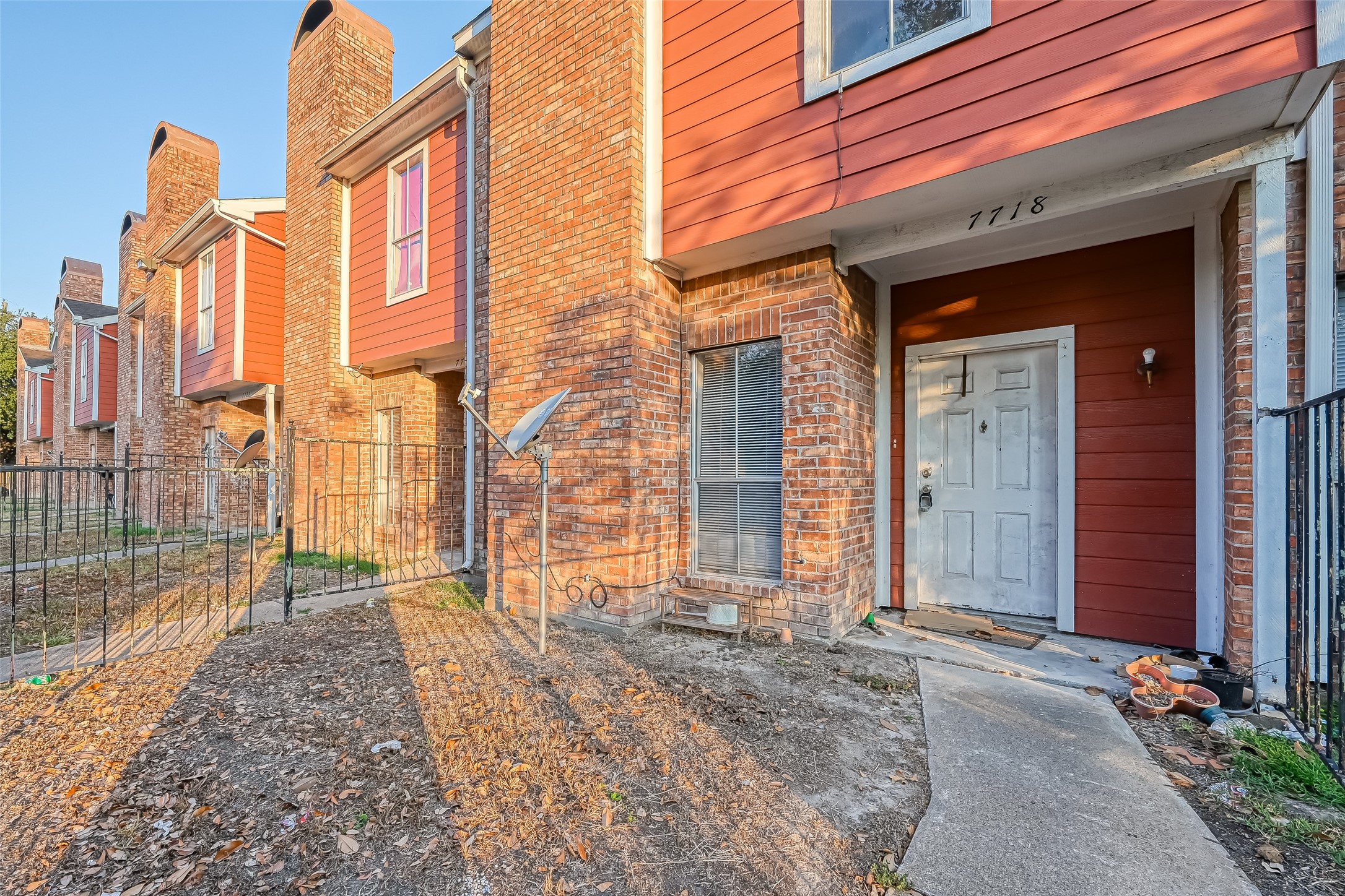 7726 West Gulf Bank Road Houston, TX 77040 - Photo 7 of 8 a view of a brick house with many windows
