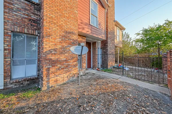 a view of a brick house with an outdoor space
