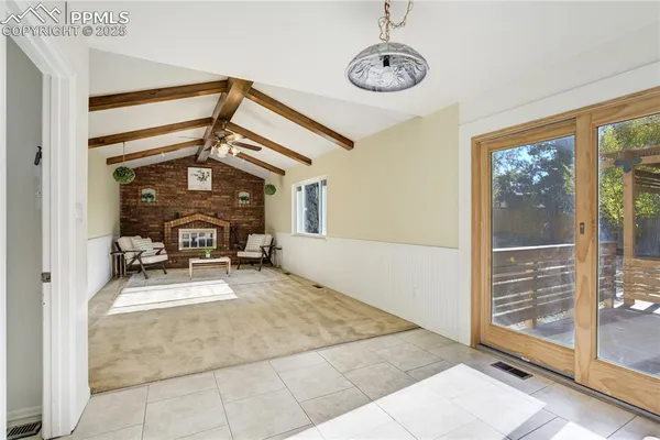 a view of a livingroom with furniture and a window