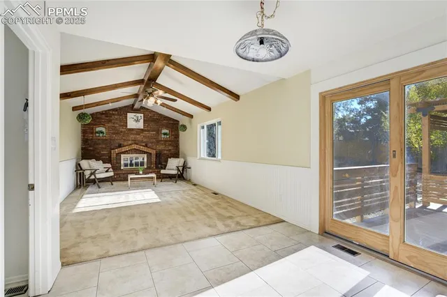 a view of a livingroom with furniture and a window