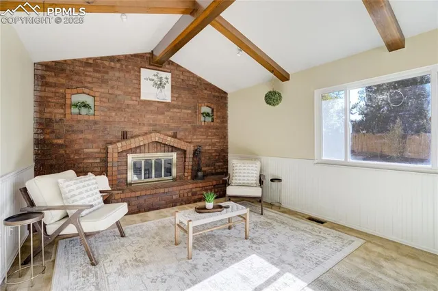 a living room with furniture and a window