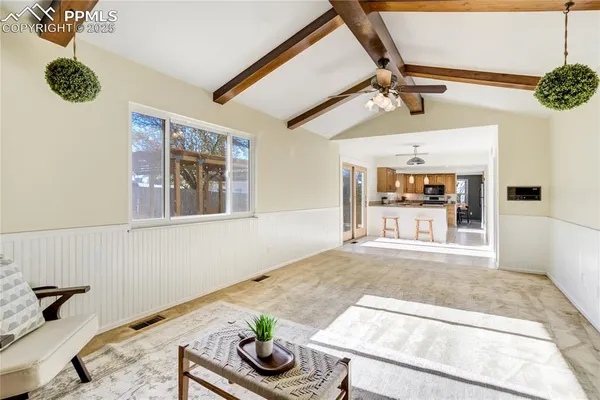 a living room with furniture and a rug