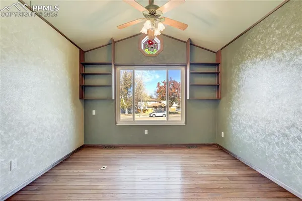 a view of an entryway with wooden floor