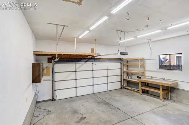a view of a room with gym equipment and windows