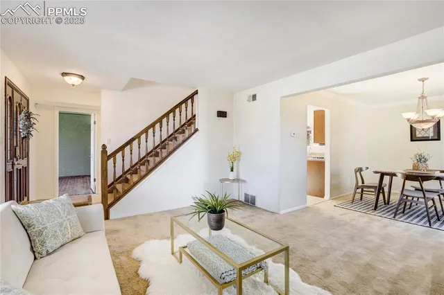 a living room with furniture and a table