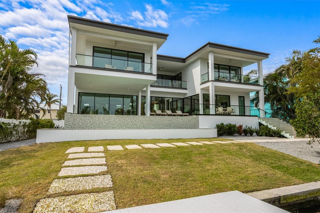 7003 Holmes Boulevard Holmes Beach, FL 34217 - Photo 60 of 70 a view of a house with swimming pool