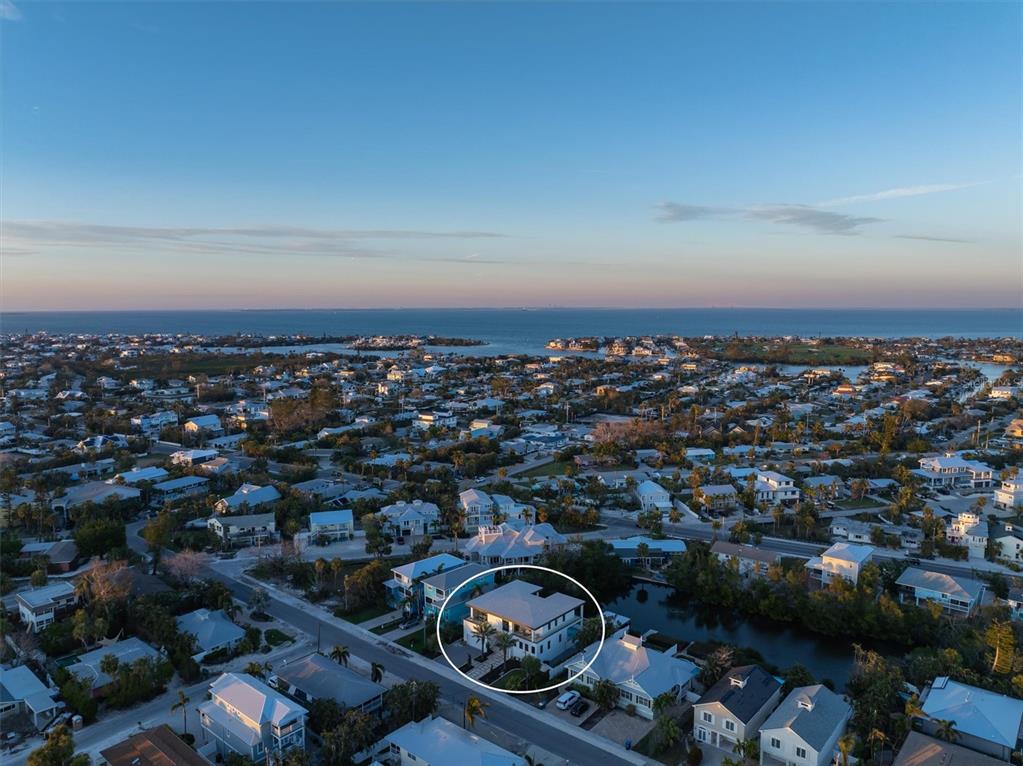 7003 Holmes Boulevard Holmes Beach, FL 34217 - Photo 69 of 70 an aerial view of a city with lots of residential buildings