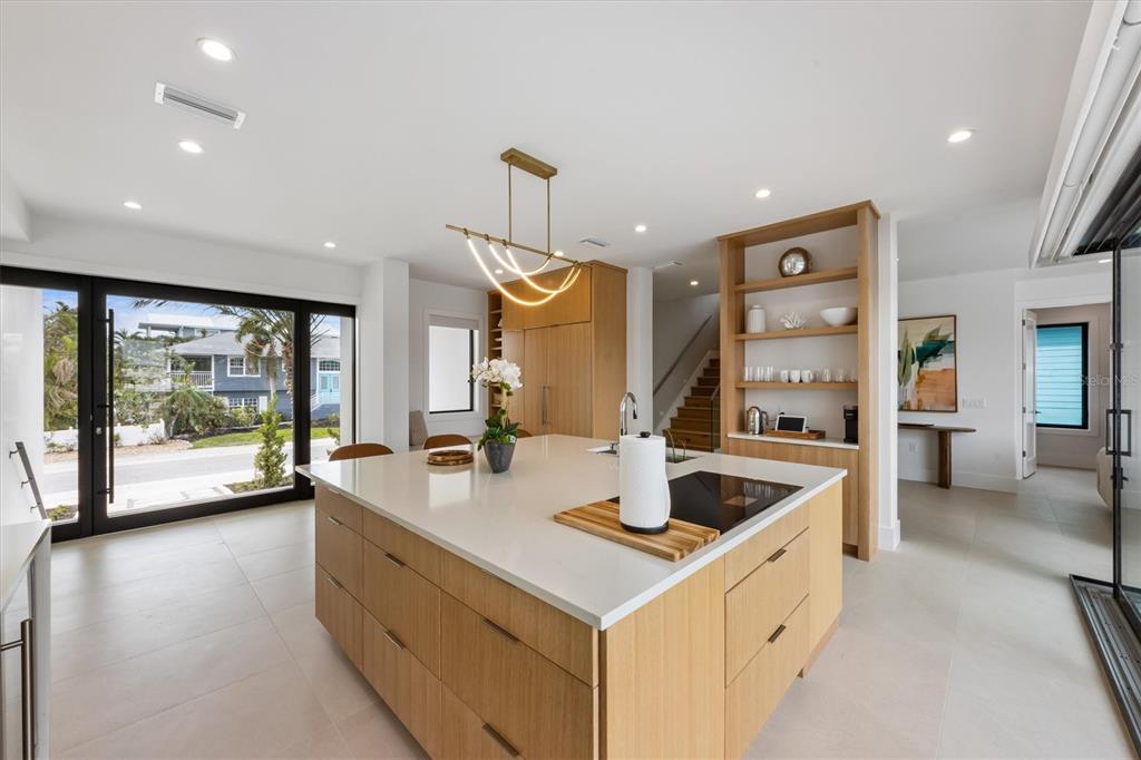 7003 Holmes Boulevard Holmes Beach, FL 34217 - Photo 9 of 70 a kitchen with counter top space and windows