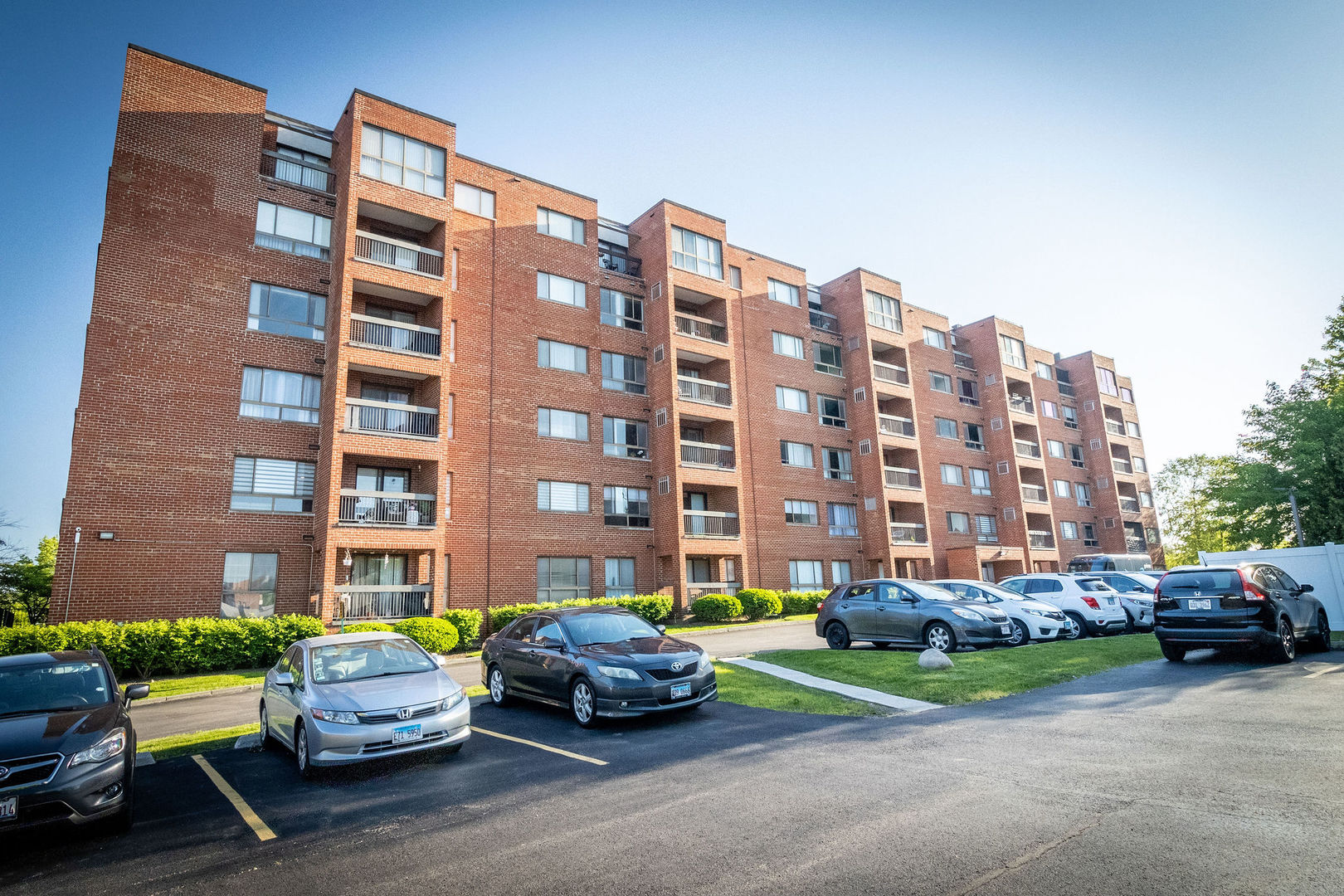 701 Forum Square, Unit 506 Glenview, IL 60025 - Photo 1 of 13 a car parked in front of a building