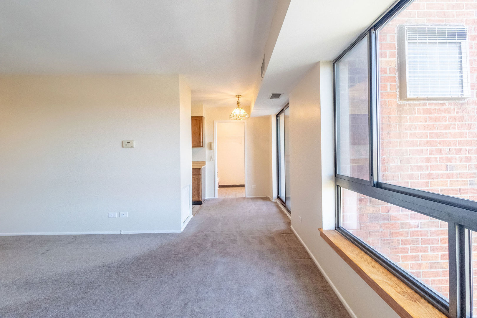701 Forum Square, Unit 506 Glenview, IL 60025 - Photo 5 of 13 a view of a room with a large window