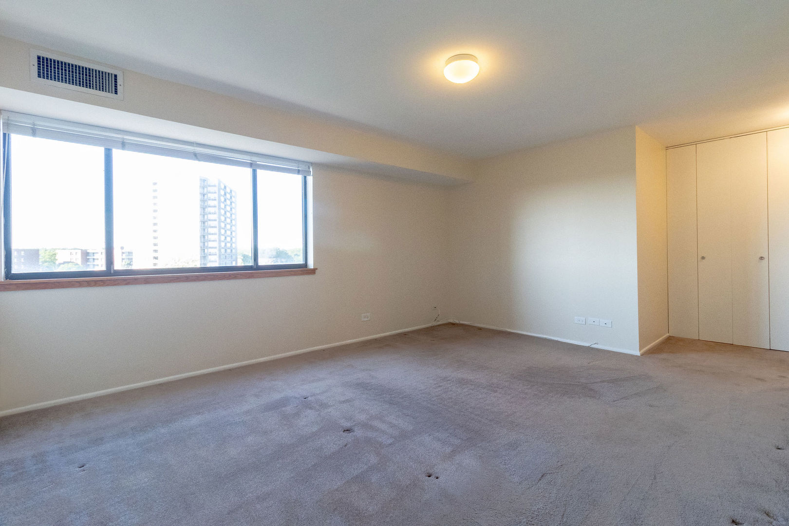 701 Forum Square, Unit 506 Glenview, IL 60025 - Photo 10 of 13 an empty room with a window