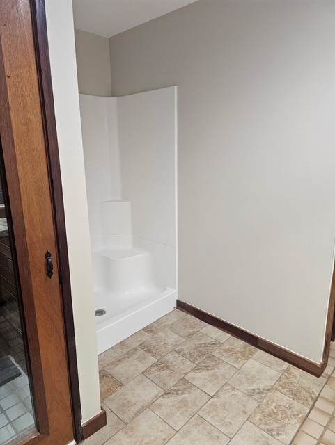 114 Houston Street Clemson, SC 29631 - Photo 12 of 19 Smooth plaster walls and warm tile flooring define this functional bathroom layout.