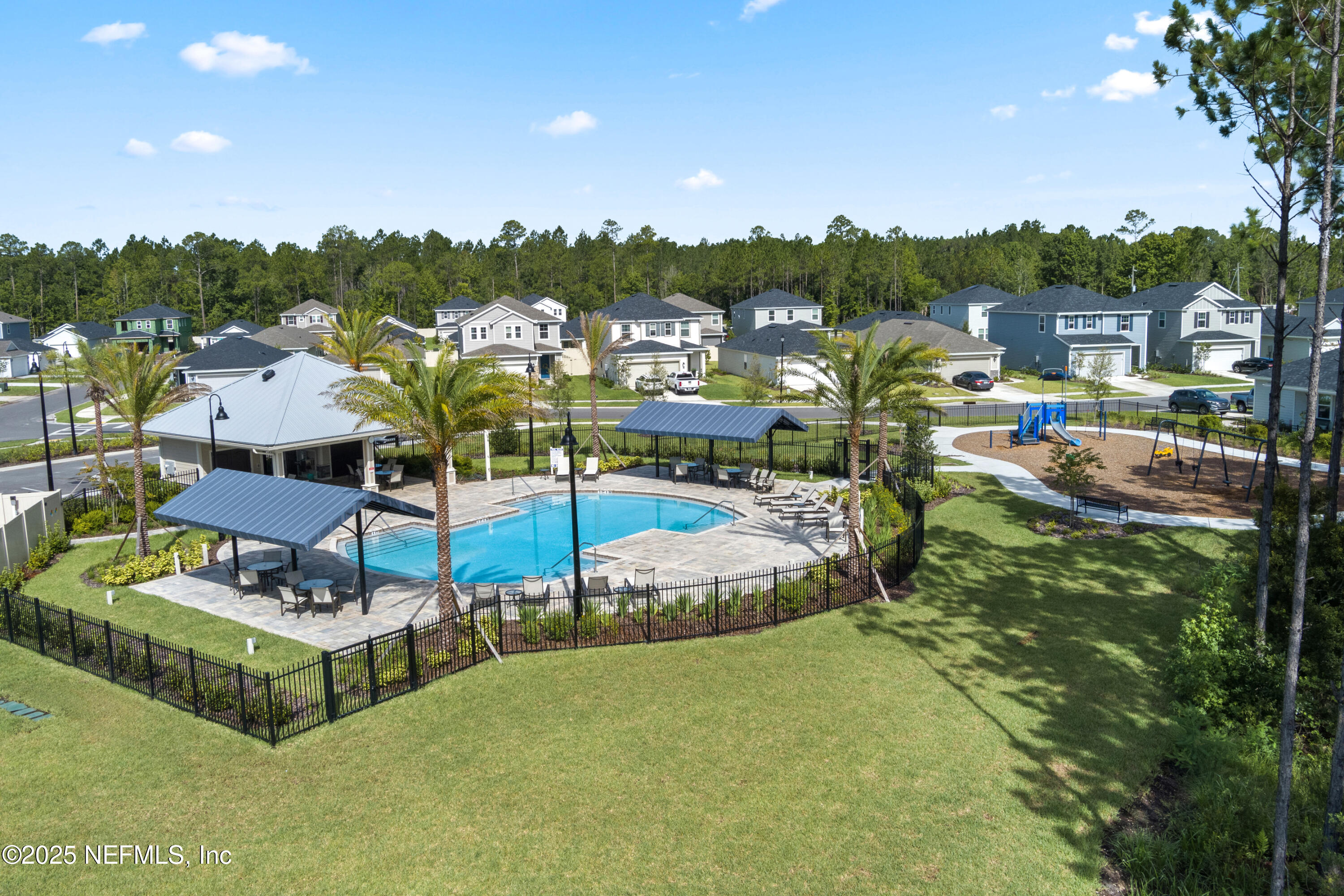 104 Stonecrest Drive St. Johns, FL 32259 - Photo 4 of 7 a view of a swimming pool and lounge chairs