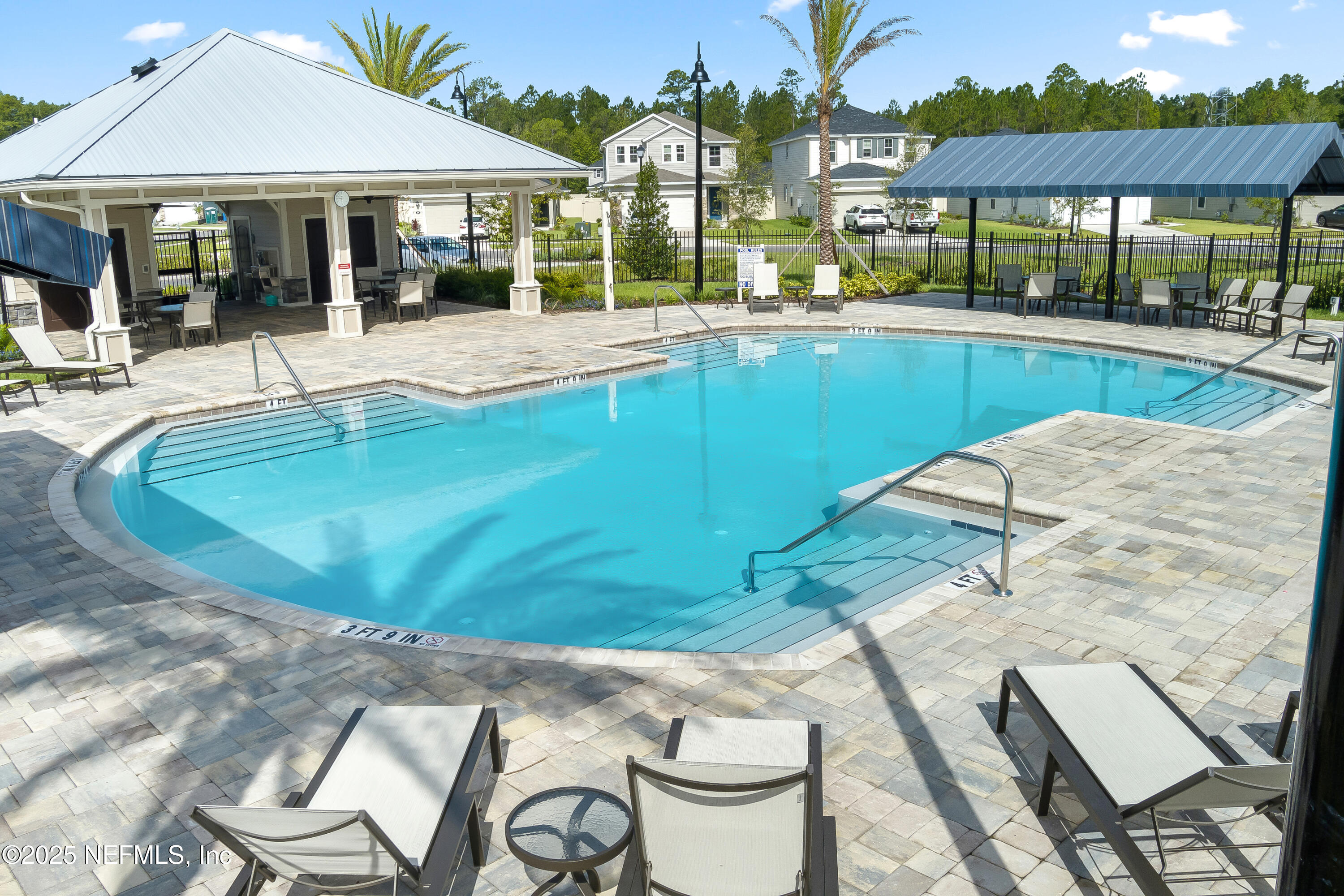104 Stonecrest Drive St. Johns, FL 32259 - Photo 5 of 7 a swimming pool with outdoor seating and yard