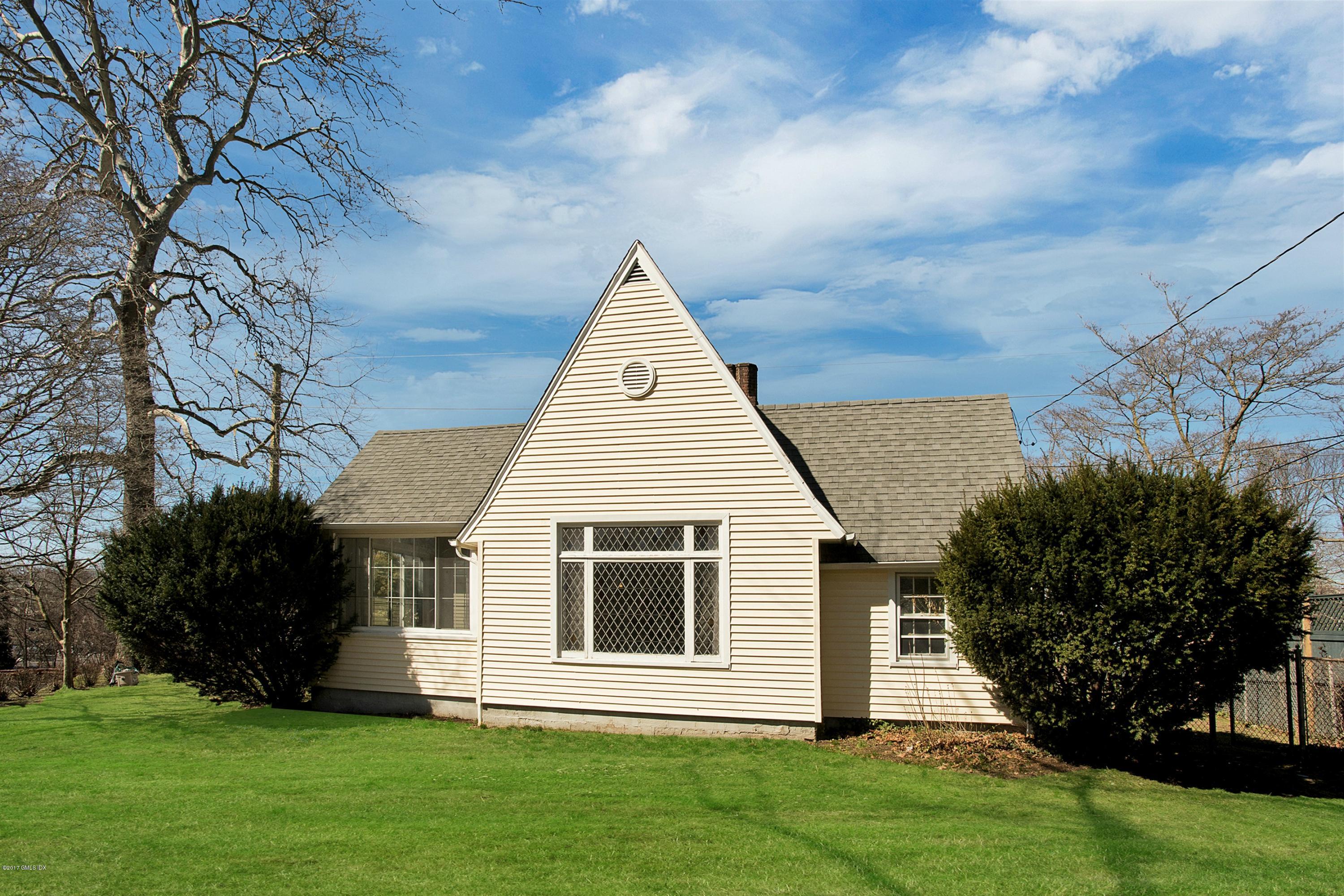 55 Oval Avenue Riverside, CT 06878 - Photo 17 of 19 a view of a house with a yard