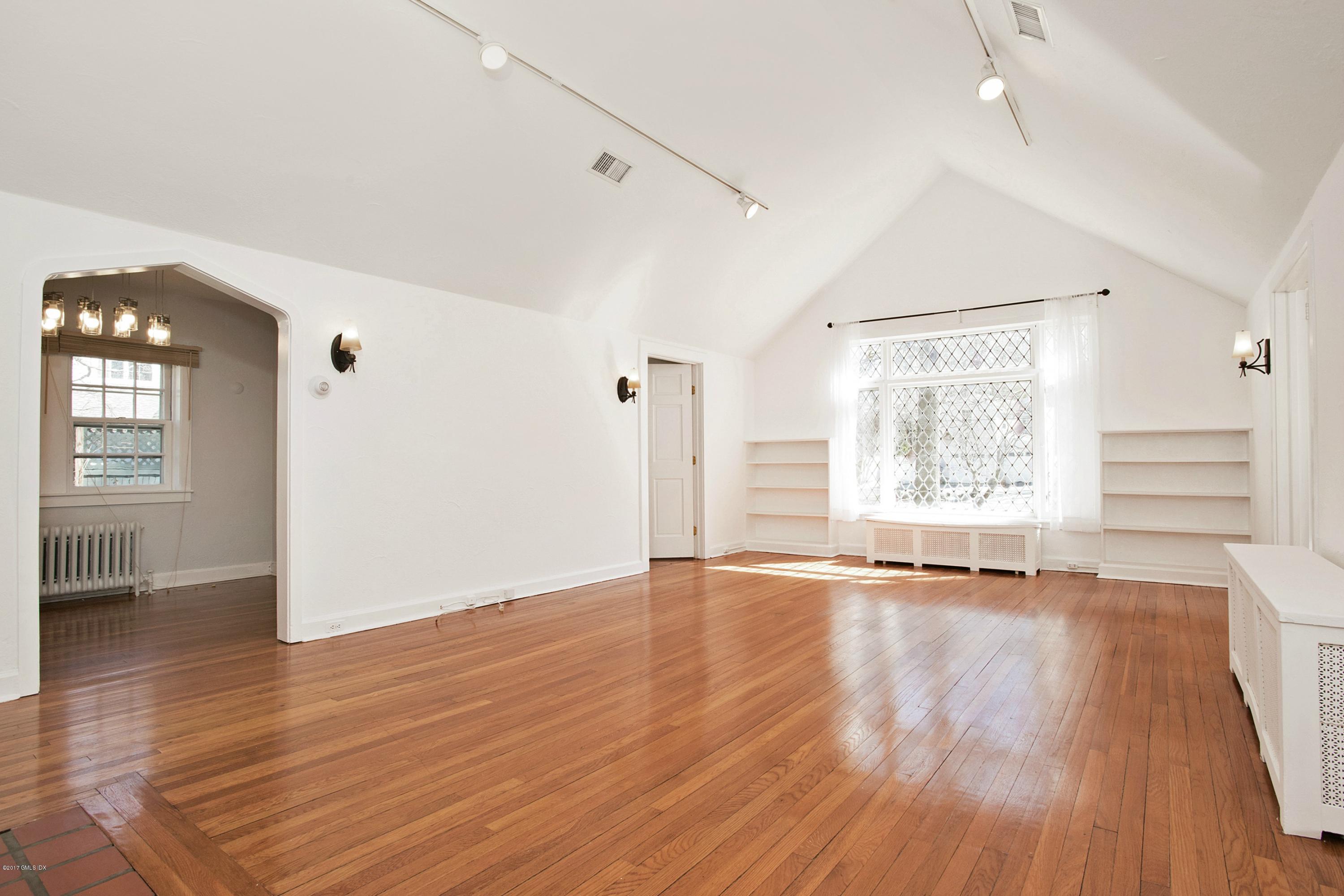 55 Oval Avenue Riverside, CT 06878 - Photo 2 of 19 wooden floor in an empty room with a window