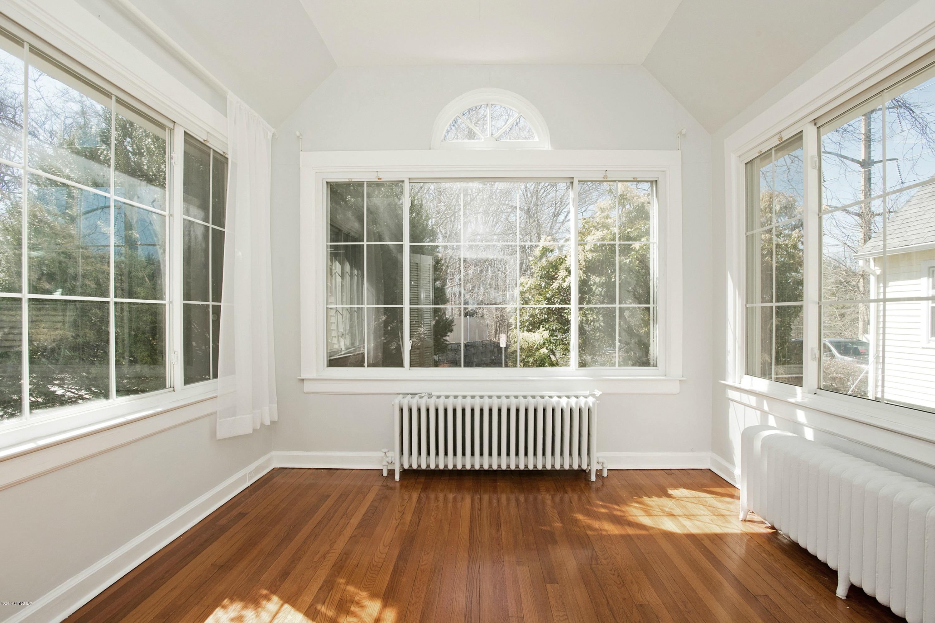 55 Oval Avenue Riverside, CT 06878 - Photo 4 of 19 a view of a room with wooden floor and a window
