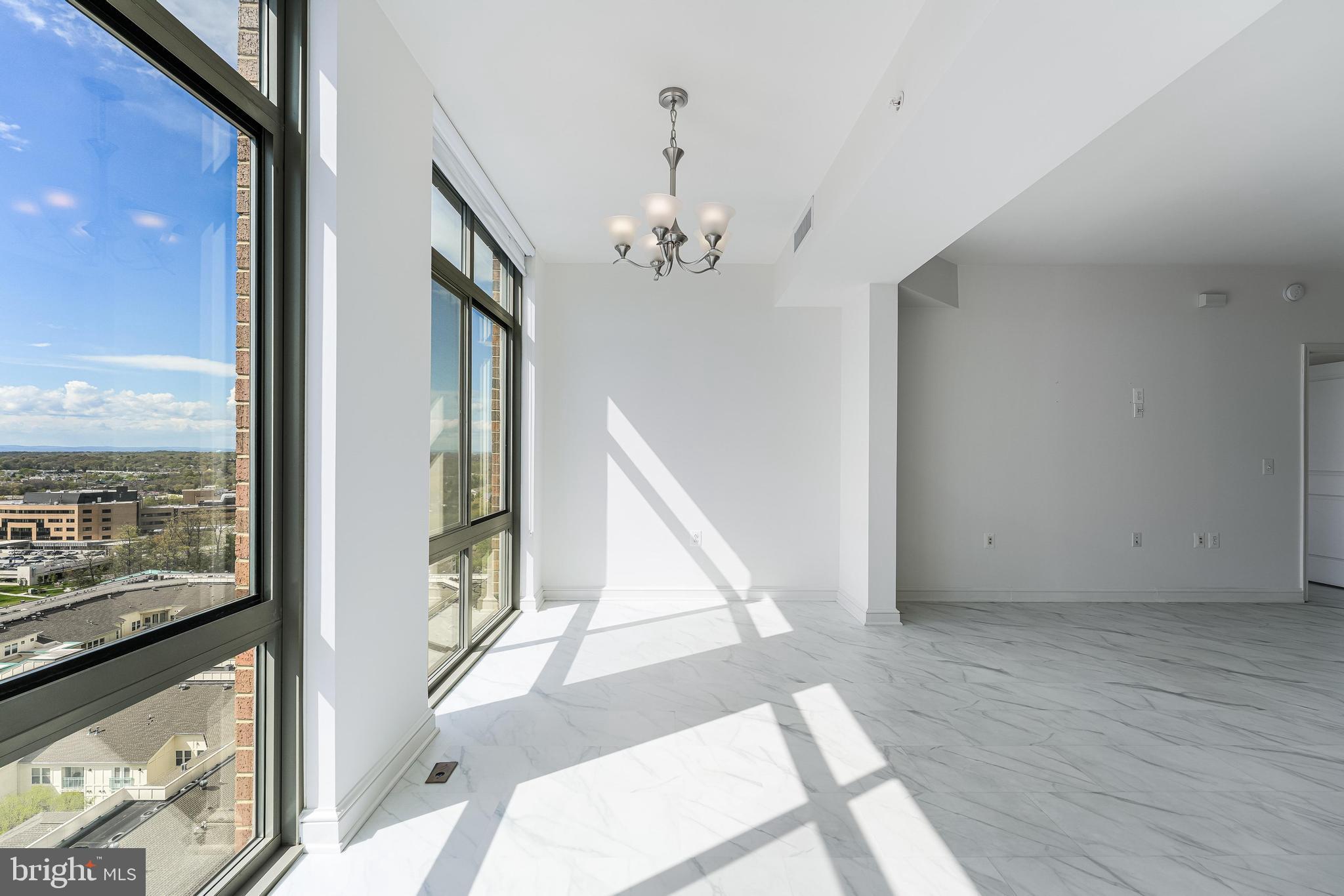 11990 Market Street, Unit 1414 Reston, VA 20190 - Photo 11 of 65 a view of a livingroom with furniture wooden floor and windows