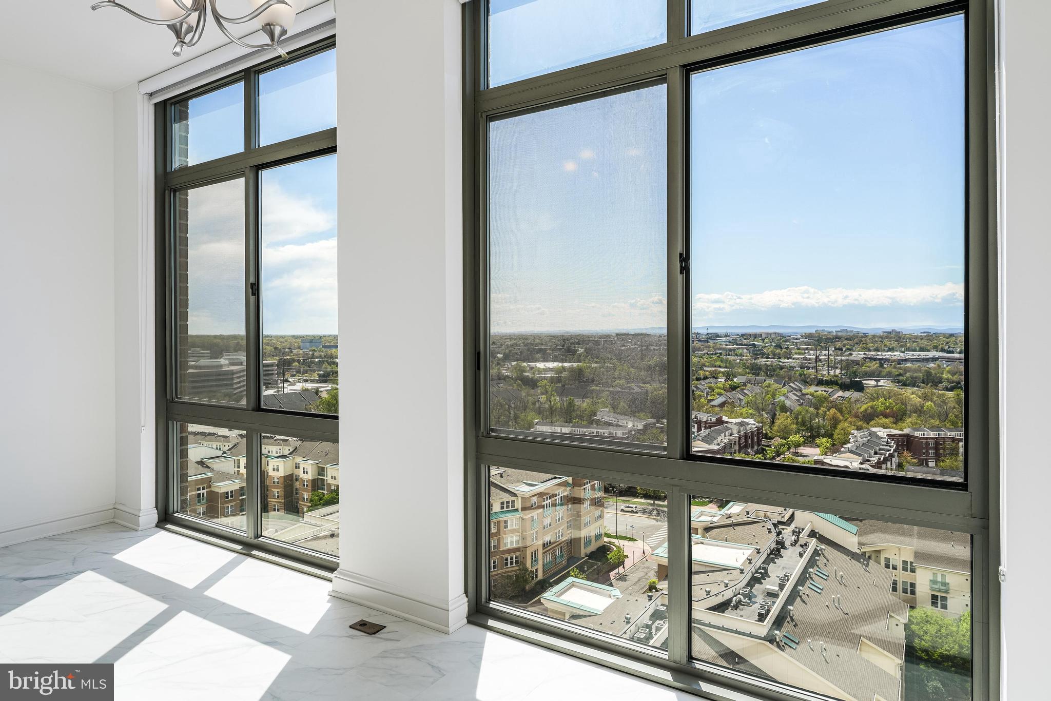 11990 Market Street, Unit 1414 Reston, VA 20190 - Photo 14 of 65 a view of a glass door with a glass windows