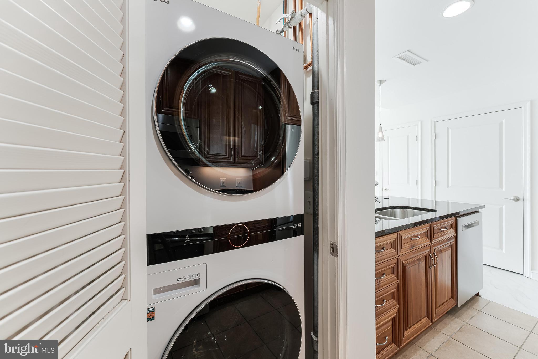 11990 Market Street, Unit 1414 Reston, VA 20190 - Photo 23 of 65 a view of washer and dryer in a utility room
