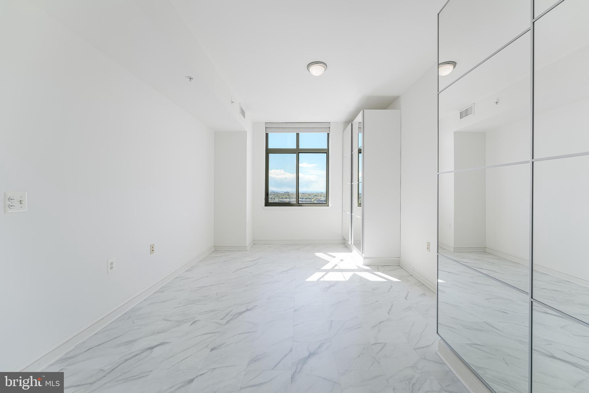 11990 Market Street, Unit 1414 Reston, VA 20190 - Photo 34 of 65 a view of a big room with windows and closet
