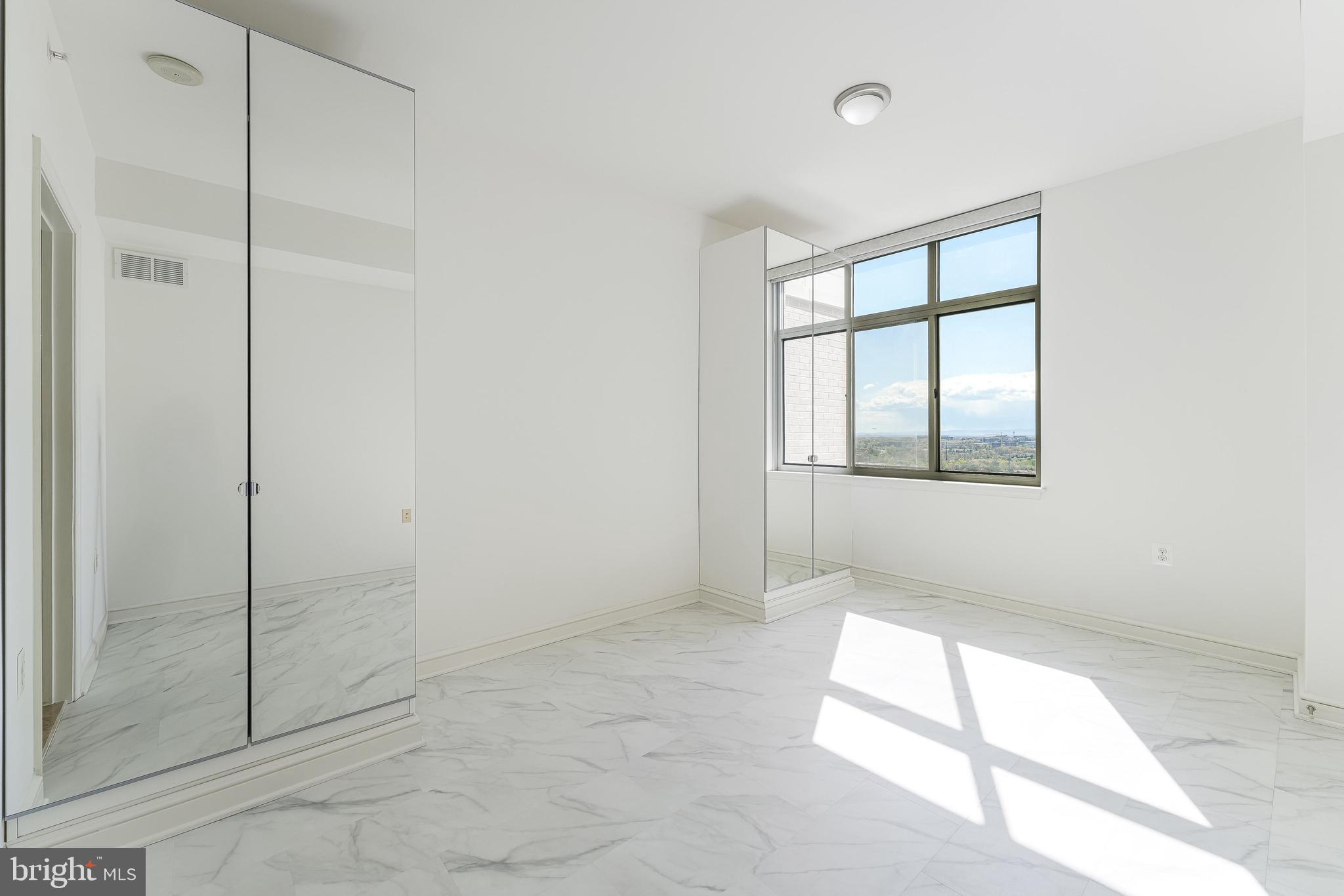 11990 Market Street, Unit 1414 Reston, VA 20190 - Photo 38 of 65 a view of an empty room with a window