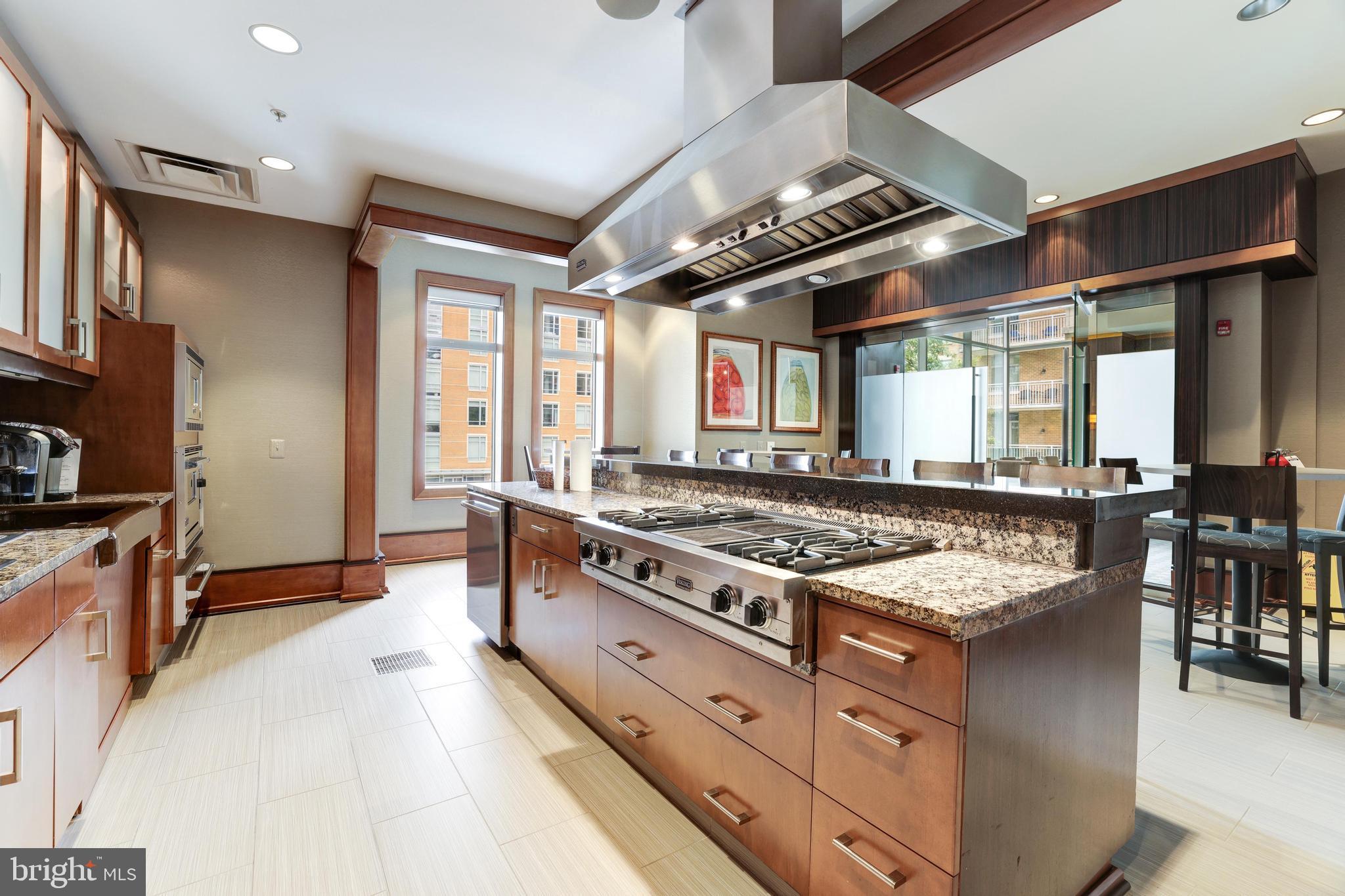 11990 Market Street, Unit 1414 Reston, VA 20190 - Photo 48 of 65 a kitchen with stainless steel appliances granite countertop a stove and a sink
