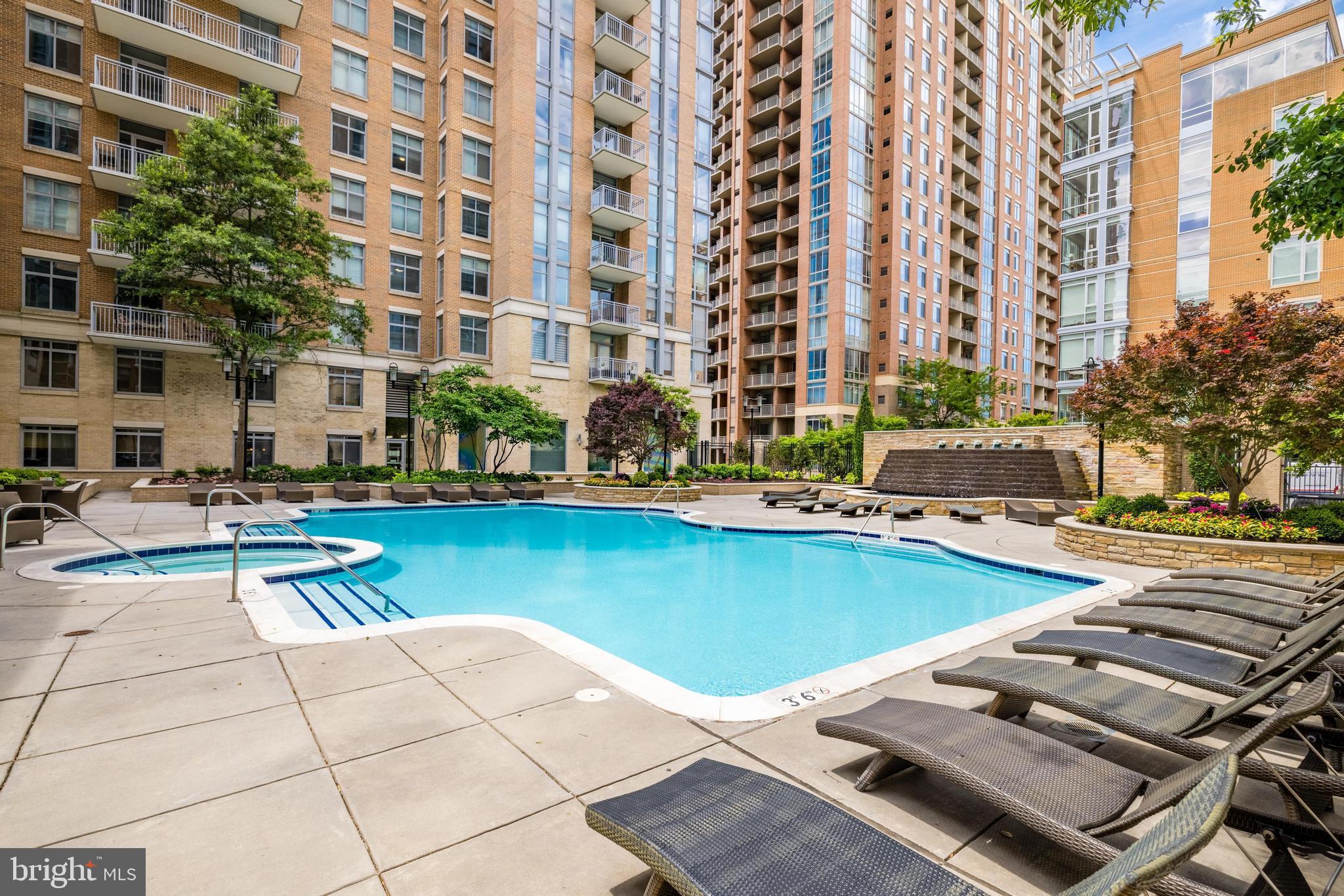 11990 Market Street, Unit 1414 Reston, VA 20190 - Photo 59 of 65 a view of outdoor space with swimming pool and lounge chair