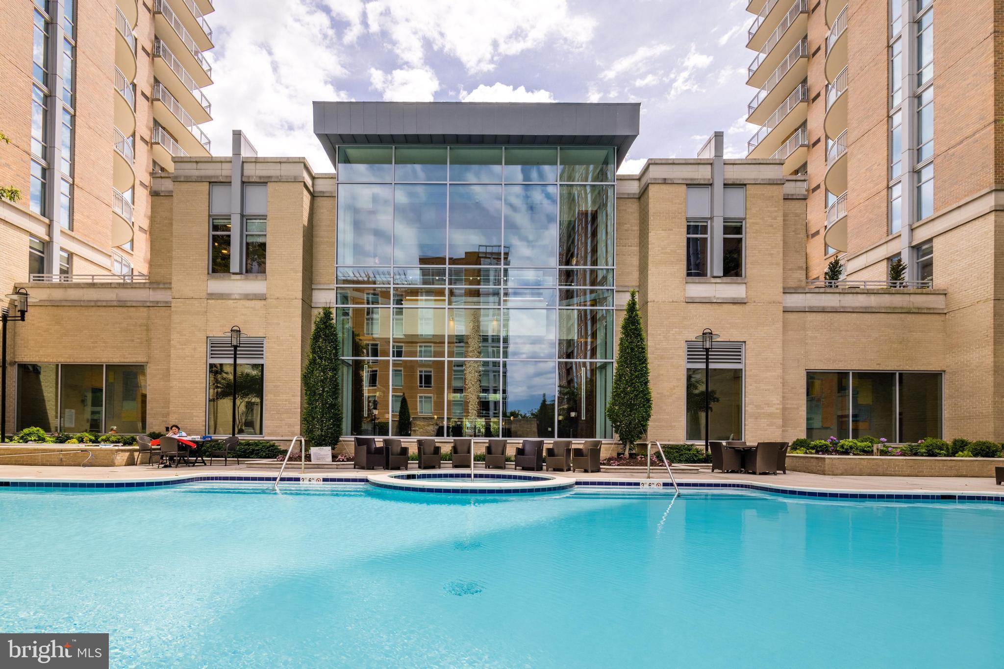 11990 Market Street, Unit 1414 Reston, VA 20190 - Photo 62 of 65 a view of swimming pool with outdoor seating